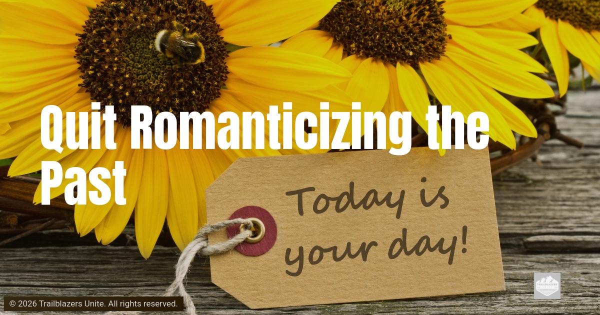 Bright yellow sunflowers surround a small paper tag with handwritten text, set on a rustic wooden surface.