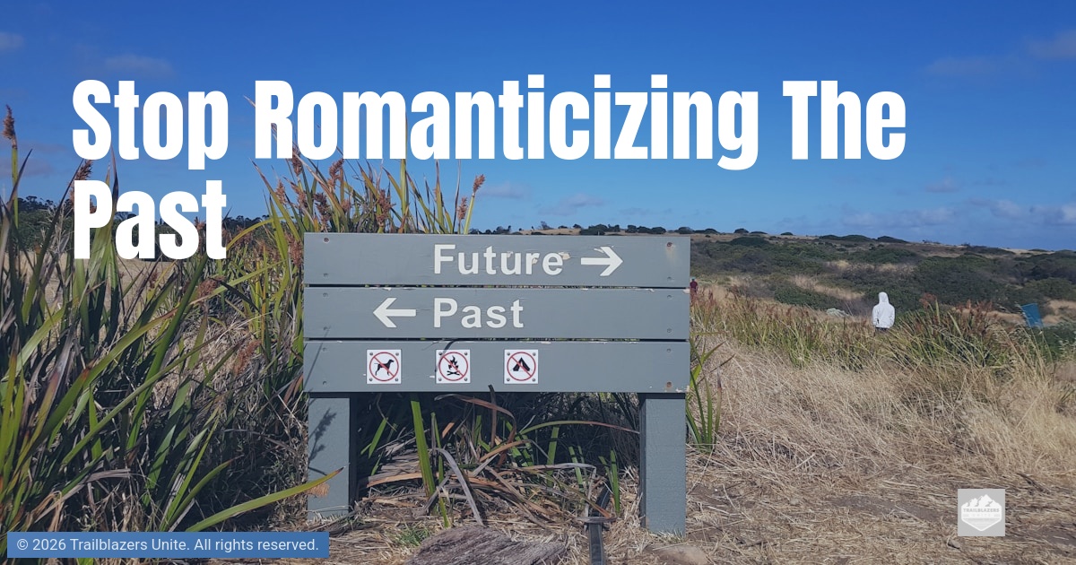 Outdoor signpost pointing toward “Future” and “Past,” surrounded by tall grass and open landscape.