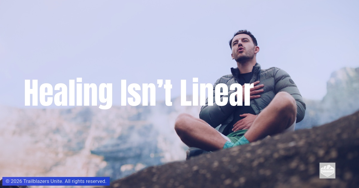 A person sits on a rock in a mountainous landscape, hands on chest, breathing calmly.